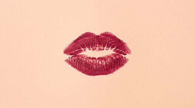 Berry Red Lipstick Kiss Print on Textured Peach Paper Background
