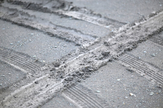 car tire tracks on the ground