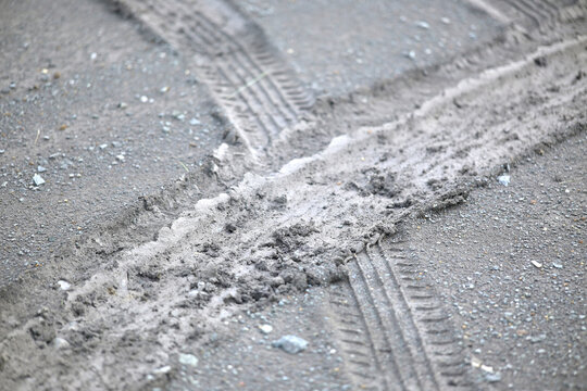 car tire tracks on the ground