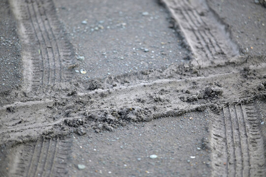car tire tracks on the ground