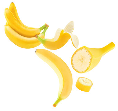 Banana fruits levitating in air on white background. Isolated Falling various banana pieces. Bananas is torn to pieces explotion. Pattern