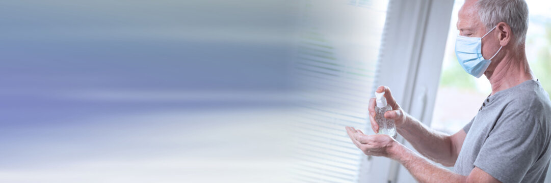 Man using hand sanitizer; prevention of virus and bacteria infection; panoramic banner