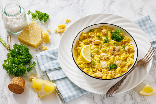 Creamy chicken and yellow rice bowl on a table