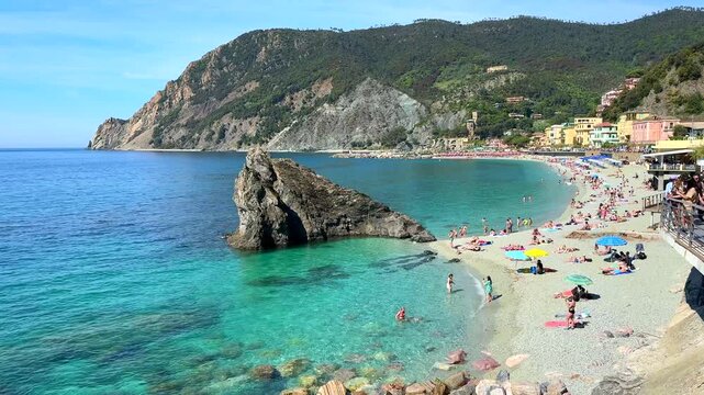 Panoramic view of Fegina beach and its iconic rock formation in Monterosso al Mare, Cinque Terre, Italy