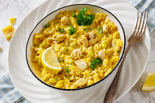 Chicken risotto with edamame beans, parsley, lemon