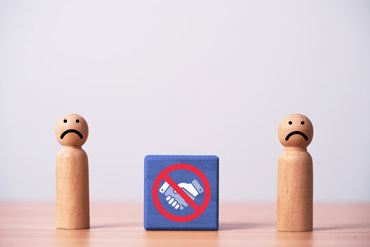 Sad wooden people with prohibited handshake symbol represent failed partnership, broken agreement, business conflict, rejected deal, disagreement, negotiation failure and end of cooperation concept.