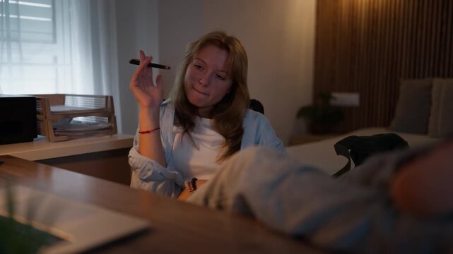 Teenage girl studying independently at home using a computer during a schoolwork session. Home education, homework, independent learning, student lifestyle and academic development concept.