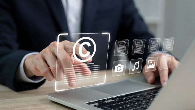 Businessman touching copyright symbol on digital screen