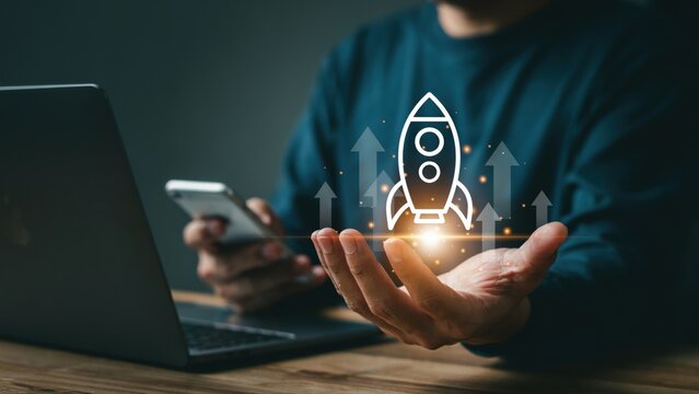 Business growth and startup success concept with rocket