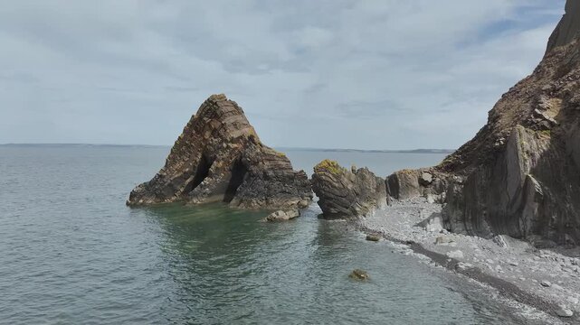 Blackchurch Rock and Cliffs over Mouthmill Beach from a drone, North Devon Coast, Devon, England