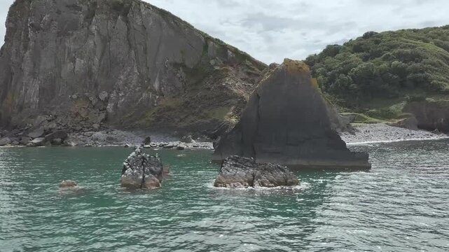 Blackchurch Rock and Cliffs over Mouthmill Beach from a drone, North Devon Coast, Devon, England