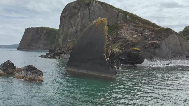 Blackchurch Rock and Cliffs over Mouthmill Beach from a drone, North Devon Coast, Devon, England