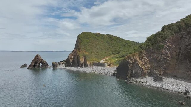 Blackchurch Rock and Cliffs over Mouthmill Beach from a drone, North Devon Coast, Devon, England