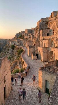Ancient stone ruins overlooking a valley at sunset time dramatic historical backdrop for travel or architectural segments, evoking timeless mystery and grandeur
