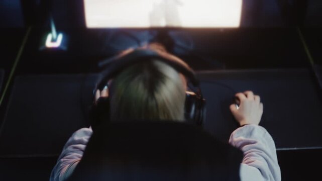 Excited woman gamer winning a video game tournament and giving a high-five to a teammate