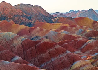 Fotobehang Bordeaux Colorful Layers of Zhangye Danxia Landform Under Evening Light  © imphilip