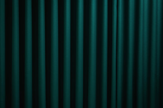 Elegant dark green fabric curtain with vertical folds for a luxury interior background