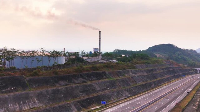 Aerial drone view of an industrial fuel storage terminal in Indonesia, featuring large storage tanks, pipelines, loading facilities, and supporting infrastructure for petroleum products and energy dis