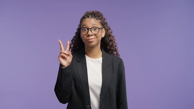 Skeptical Curly Teenage Student Girl With Glasses Making Air Quotes With Both Hands, Cynical Expression, Sarcasm, Irony, Doubt, Suspicion, Distrust And Questioning Information