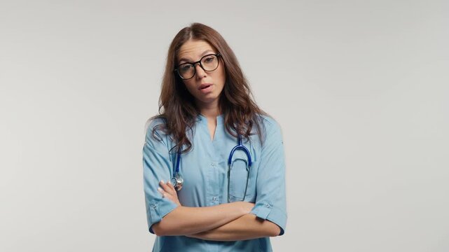 Annoyed Female Doctor Sighing And Rolling Eyes With Irritated Expression, Frustrated Physician Reacting To Patient Problem, Workplace Stress, Disbelief, Fatigue And Displeasure