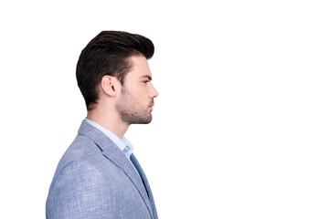 Side view profile portrait with copy space of stunning manly man in suit with serious expression isolated on grey background © deagreez