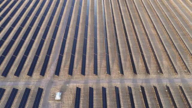 Aerial View of Utility-Scale Solar Farm with Battery Energy Storage System in Arid Desert