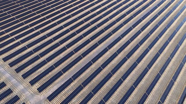 Aerial View of Utility-Scale Solar Farm with Battery Energy Storage System in Arid Desert