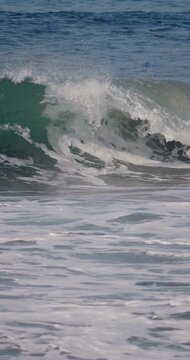 Powerful ocean wave crashing in ocean. Slow motion