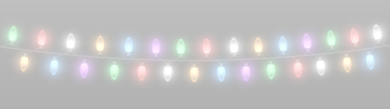 Colorful Christmas string lights with glowing bulbs, festive sparkle and holiday decoration.
