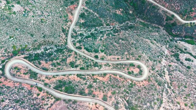 Aerial of winding dirt road mountain pass, Swartberg pass, South Africa