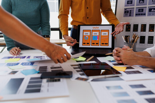 Ux ui creative team collaborating on mobile app design, planning user interface development and wireframing