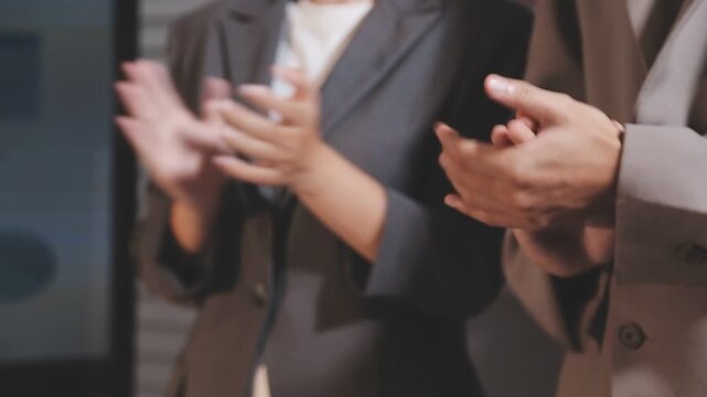 Group of asian businesspeople clapping hands congratulation.