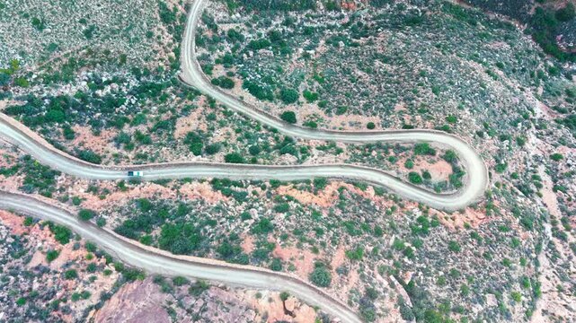 Aerial of winding dirt road mountain pass, Swartberg pass, South Africa