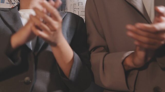 Group of asian businesspeople clapping hands congratulation.