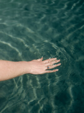 woman's hand in water in Sardinia
