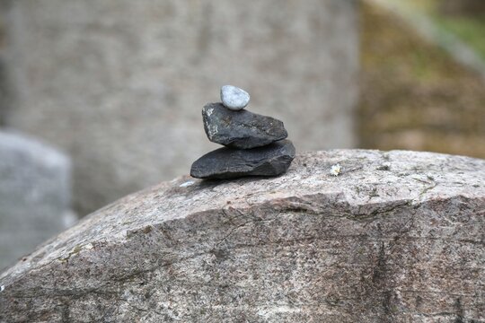 Visitation stones at Old Jewish Cemetery in Zizkov district in Prague, Czech Republic. Visitation stones are placed on graves by visitors according to Jewish bereavement practices.