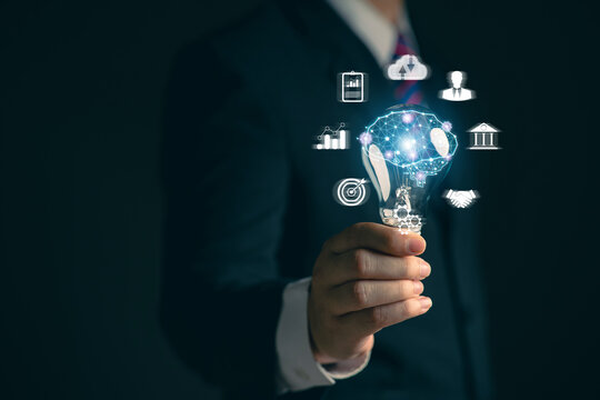 Businessman holding a light bulb. Network. Online business. Online business networking.. New ideas. Innovative ideas for online marketing...