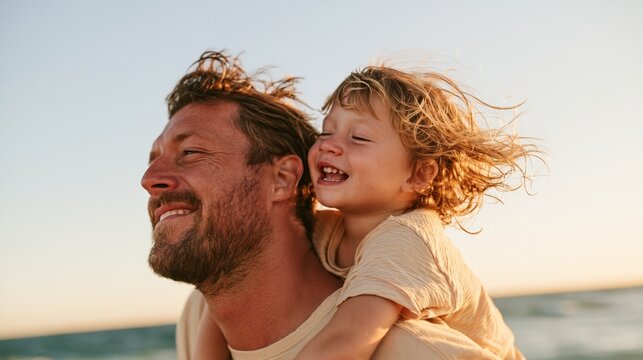 Father and daughter enjoying a sunny day at the beach.