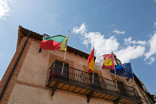 Hita town hall building displaying spanish and eu flags