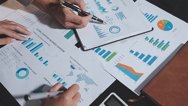 Business partnership coworkers using a tablet to analysis graph company financial budget report and cost work progress and planning for future in office room.