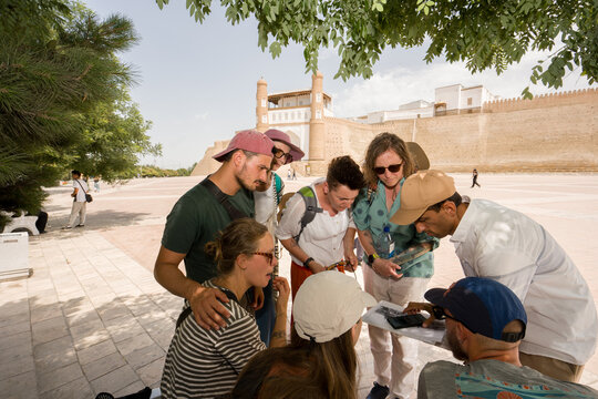 Tour Group Gathers Around Guide In Bukhara, Uzbekistan