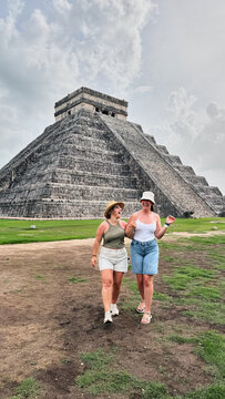 Women tourists enjoying Chichen Itza trip in Mexico