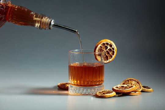 Old-fashioned cocktail preparation.