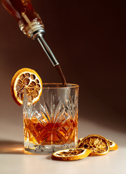 Old-fashioned cocktail preparation.