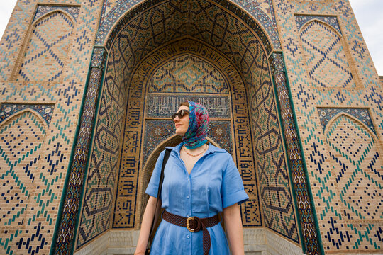 Woman Near Historic Building In Uzbekistan