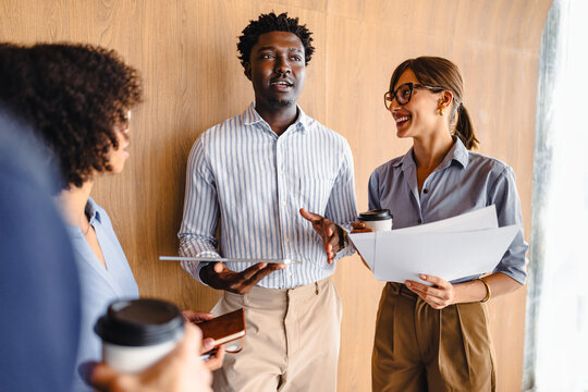 People Talking and Sharing Ideas in Office Setting