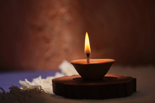 Warm glow of a single oil lamp illuminating a peaceful scene