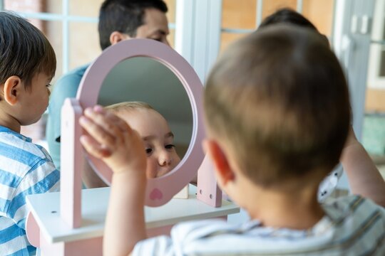 Children Playing With Toy Mirror