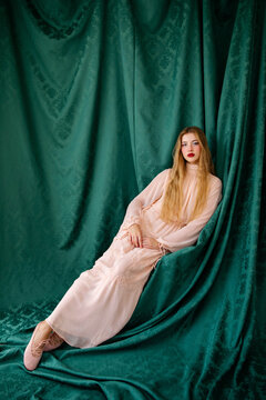 Stylish woman on green backdrop