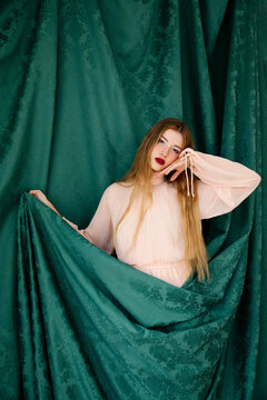 Wodel wrapped in emerald green fabric